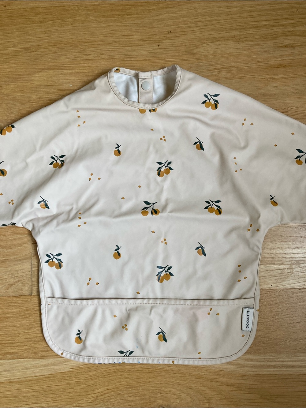 Waterproof Kids Feeding Bib Smock in Cream with Orange Print